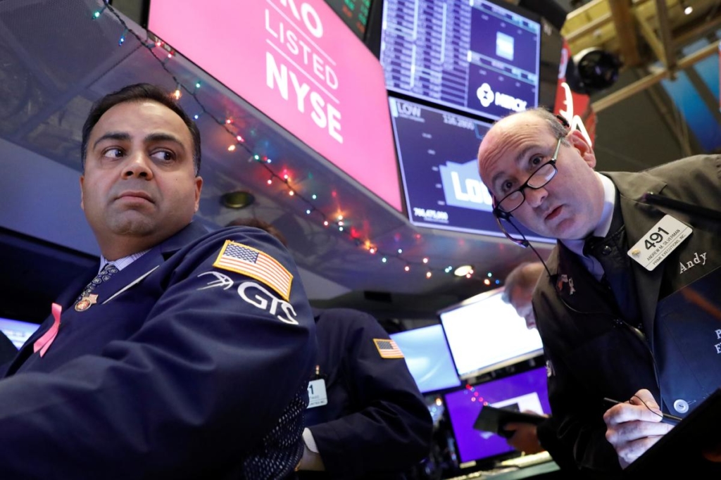Global stocks extend gains after Fed keeps rates on hold; oil falls