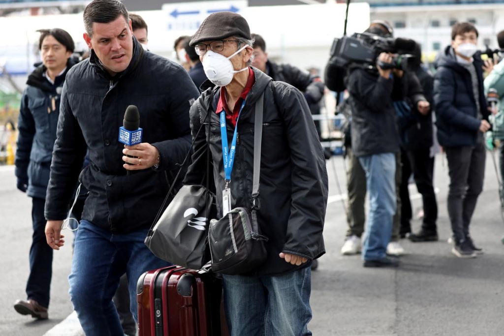 Passengers leave coronavirus cruise ship at last as Japan control efforts come under fire