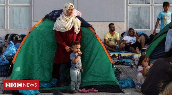 Lesbos: Greek police move migrants to new camp after Moria fire Lesbos: Greek police move migrants to new camp after Moria fire